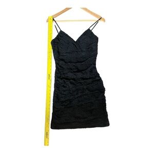 Lace mini with spaghetti straps. Size 7. Black